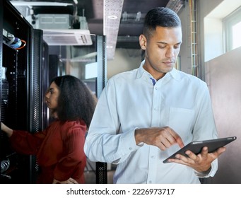 Management, server room and tablet with business people in data center for cloud computing, cybersecurity and hardware network. Technology, internet and it with maintenance employee for innovation - Powered by Shutterstock