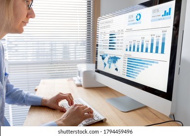 Manager analysing performance data on dashboard with KPI and metrics. Business analytics used in operations and sale management. Businesswoman working in modern office with indicators.