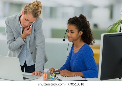 manager and assistant in office working 