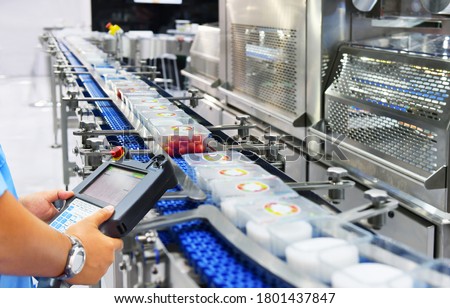 Manager check and control automation Food products boxs transfer on Automated conveyor systems in factory