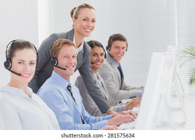 Manager Checking The Work Of The Staff In Call Center