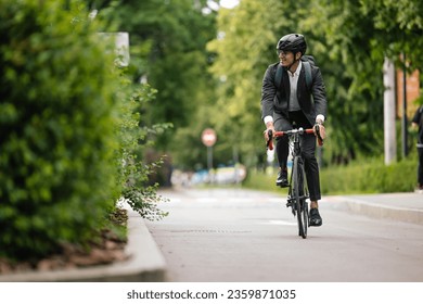 Manager commuting to the office by bike - Powered by Shutterstock