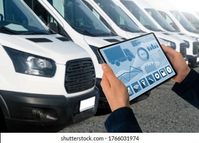 Manager With A Digital Tablet On The Background Of Vans. Fleet Management