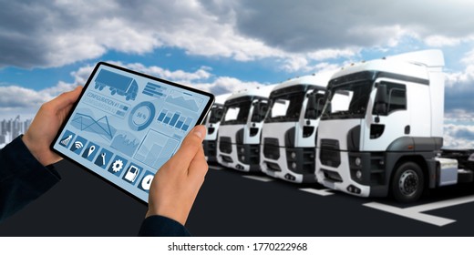 Manager with a digital tablet on the background of semi trucks. Fleet management