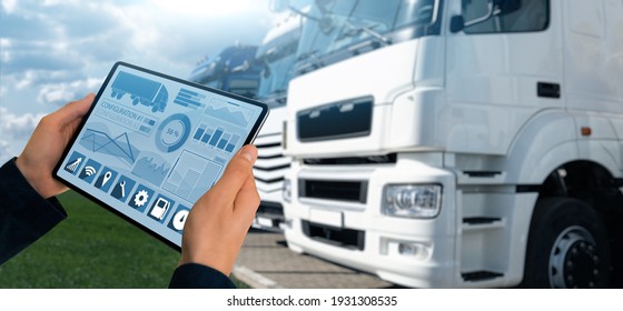 Manager With A Digital Tablet On The Background Of Trucks. Fleet Management