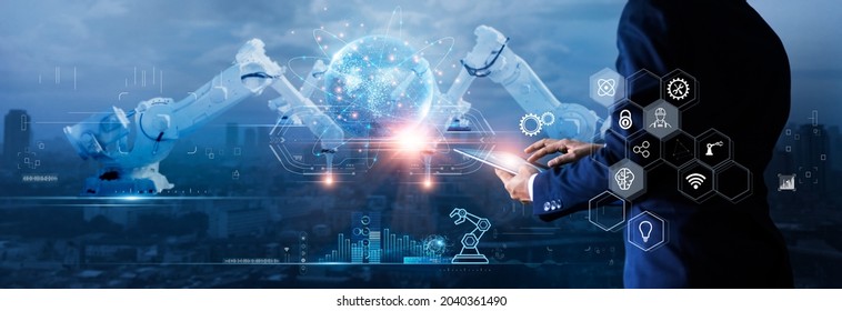 Manager engineer check and control automation robot arms machine on global network and monitoring software. Innovation of robotics and digital manufacturing operation on futuristic and industry 4.0. - Shutterstock ID 2040361490