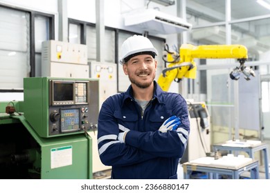 Manager engineer check and control automation robot arms machine in intelligent factory industrial on real time monitoring system software. Welding robotics and digital manufacturing operation.