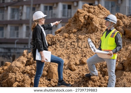 Manager and engineer working Industrial pipeline used for water supply or electrical cable protection large cylindrical arranged in infrastructure underground utilities and public infrastructure.
