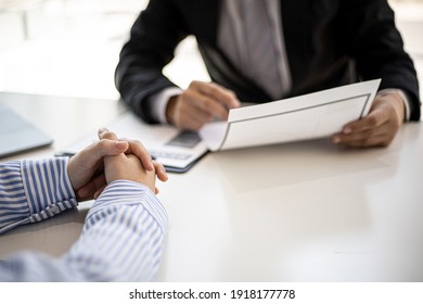 The manager is explaining information about the job position being hired to the job applicant, the manager explains the job qualifications, salary benefits. Job application ideas. - Shutterstock ID 1918177778