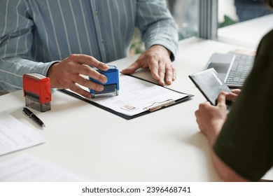 Manager giving visa to client