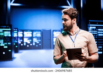 Manager in high tech facility looking at server rigs used for computationally intensive tasks such as molecular modeling or physical simulations. Expert doing annual equipment maintenance