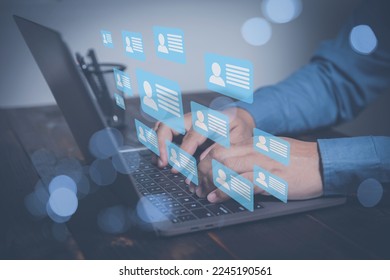 Manager human resources checking CV online to choose the perfect employee for his business. Search of employees interview by technology digital internet online simplifying the human resources system. - Shutterstock ID 2245190561