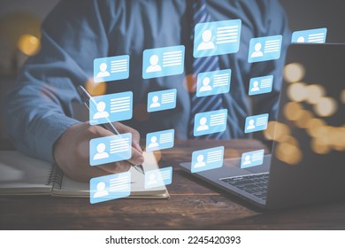 Manager human resources checking CV online to choose the perfect employee for his business. Search of employees interview by technology digital internet online simplifying the human resources system. - Shutterstock ID 2245420393