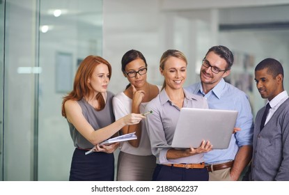 Manager With Laptop Showing, Training Or Presenting Strategy Ideas Or Brainstorm Plans With Diverse Group Of Office Colleagues. Confident, Smiling Or Happy Leader Updating Team Of Staff On