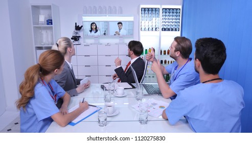 Manager Man With Medical Doctor Team Talking Having Online Conference In Boardroom, Hospital Audit Meeting Concept In Healthcare Centre Room
