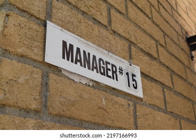 Manager Plaque On Brick Wall