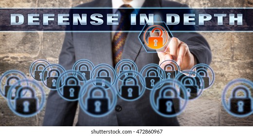 Manager Is Pressing DEFENSE IN DEPTH On A Virtual Control Screen. Information Assurance Concept And Technology Metaphor For A Computer Network Defense Strategy Using Multiple Layers Of Security.
