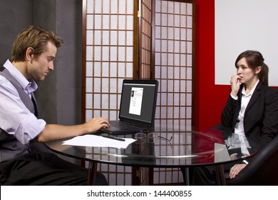 Manager reviewing workers job performance