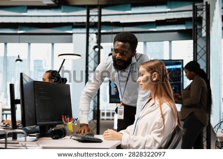 Manager reviews code snippets with a junior developer, adjusts configurations, runs diagnostic tools, and monitors API cloud services in a modern workspace