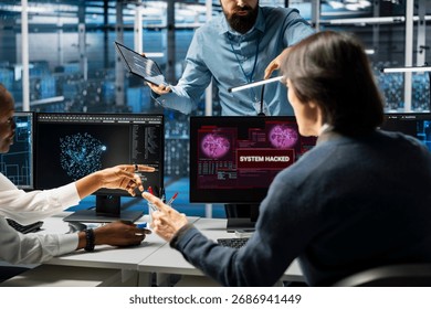 Manager and server hub technicians use AI LLM assistant to stop hacker steal sensitive company data. Data center supervisor and employees removing computer virus breaching security systems