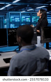 Manager in server hub using computer to find firewall misconfigurations affecting rackmounts performance. Supervisor checking systems bottlenecks leading to sluggish data transfer rates