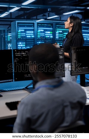 Manager in server hub using computer to find firewall misconfigurations affecting rackmounts performance. Supervisor checking systems bottlenecks leading to sluggish data transfer rates