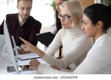 Manager Showing Work Application, Explaining Task Or Project To New Employee. Focused Female Mentor Teaching Intern. Fresh Worker Studying Under Office Coach. Mentorship, Career Training Concept