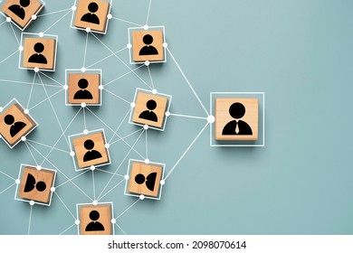 Manager and staff icon print screen on wooden cube block with connection link network for organisation structure in company  social network and teamwork concept.
