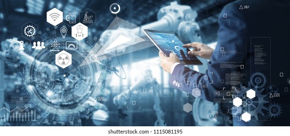 
Manager Technical Industrial Engineer working and control robotics with monitoring system software and icon industry network connection on tablet. AI, Artificial Intelligence, Automation robot arm.  - Shutterstock ID 1115081195