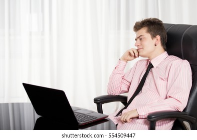 Manager thinks. Manager sits at a table and thinks