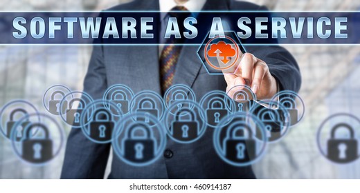 Manager is touching SOFTWARE AS A SERVICE on an interactive control screen. Business concept. Cloud computing metaphor for software delivery methods, services management and SaaS.