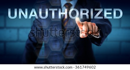 Manager is touching the word UNAUTHORIZED on a screen. Business metaphor and technology concept for computing access restrictions, information security and data confidentiality.
