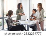 Manager, training and group of business women in meeting, coaching or learning in creative startup. Team, leader and discussion for brainstorming ideas, project update and metrics for event planning