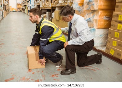 Manager Training Worker For Health And Safety Measure In A Large Warehouse