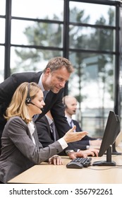 Manager Training Young Woman In A Call Center