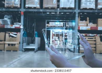 Manager using smart tablet monitor process Analyzes, check and control product in stock warehouse, modern software, futuristic concept smart warehouse management system in Factory industry in  - Powered by Shutterstock