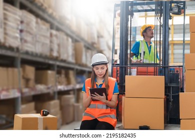Manager  using tablet Checke-Commerce Online Orders e-businessonline. In store Background Warehouse Retail Center with  boxes global logistics network  Products Delivery Infographics in Logistics