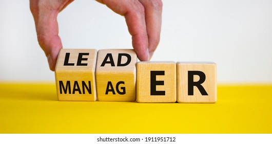 Manager versus leader symbol. Businessman flips wooden cubes and changes the word 'manager' to 'leader'. Beautiful white background, copy space. Business and manager versus leader concept. - Shutterstock ID 1911951712