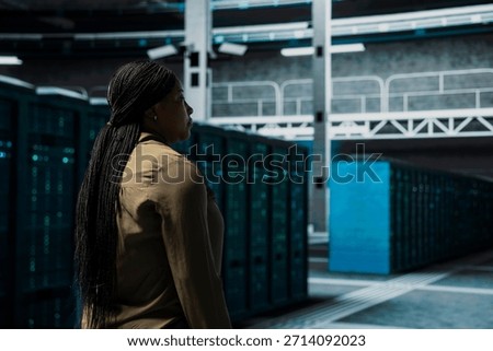 Manager walking in data center with supercomputers supporting business needs. Server room supervisor doing checkup, ensuring hardware works at optimum performance for smooth operations
