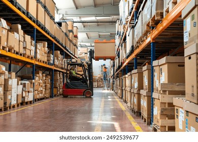 Manager wearing hard hat with digital tablet counts merchandise in warehouse. He walks through rows of storage racks with merchandise.	
 - Powered by Shutterstock