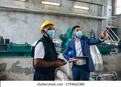 Manager And Worker In Industry Plant, Wearing Safety Mask Due Covid Virus