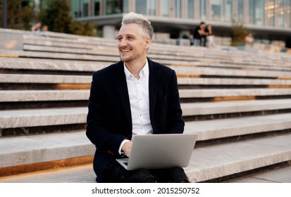 The Manager Is Working On A Presentation For Colleagues On A New Project. A Law Student Studies Online On A Laptop.