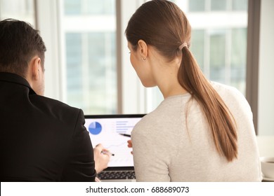Managers analyzing project stats at pc laptop screen, discussing advertising campaign effectiveness, studying infographic information, using software for analysis, business intelligence, rear view