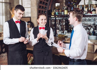 Manager's briefing with the waiters. Restaurant manager and his staff.  - Powered by Shutterstock