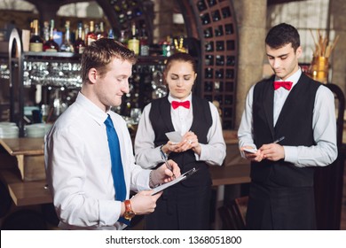 Manager's briefing with the waiters. Restaurant manager and his staff.  - Powered by Shutterstock