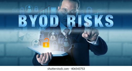 Managing director is touching BYOD RISKS on a virtual touch screen interface. Business phenomenon metaphor and information technology concept for Bring Your Own Device and IT consumerization.