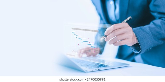 managing milestones on a timeline Gantt chart in technology online. concept of project planner in software, schedule plan management work update, and workflow. updating appointment staff of business - Powered by Shutterstock