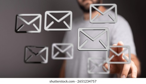 Managing Multiple Emails: A Man Interacts with Digital Mail Icons