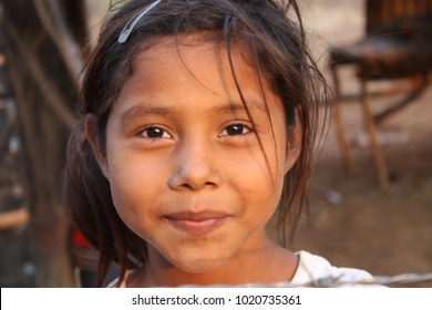 Managua, Nicaragua - May 07, 2013: A young girl smiles while playing with missionaries at church.