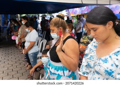 Managua, Nicaragua, November 5th 2021:  Hispanic Family Praying God For Coronavirus Pandemic During An Religious Event.